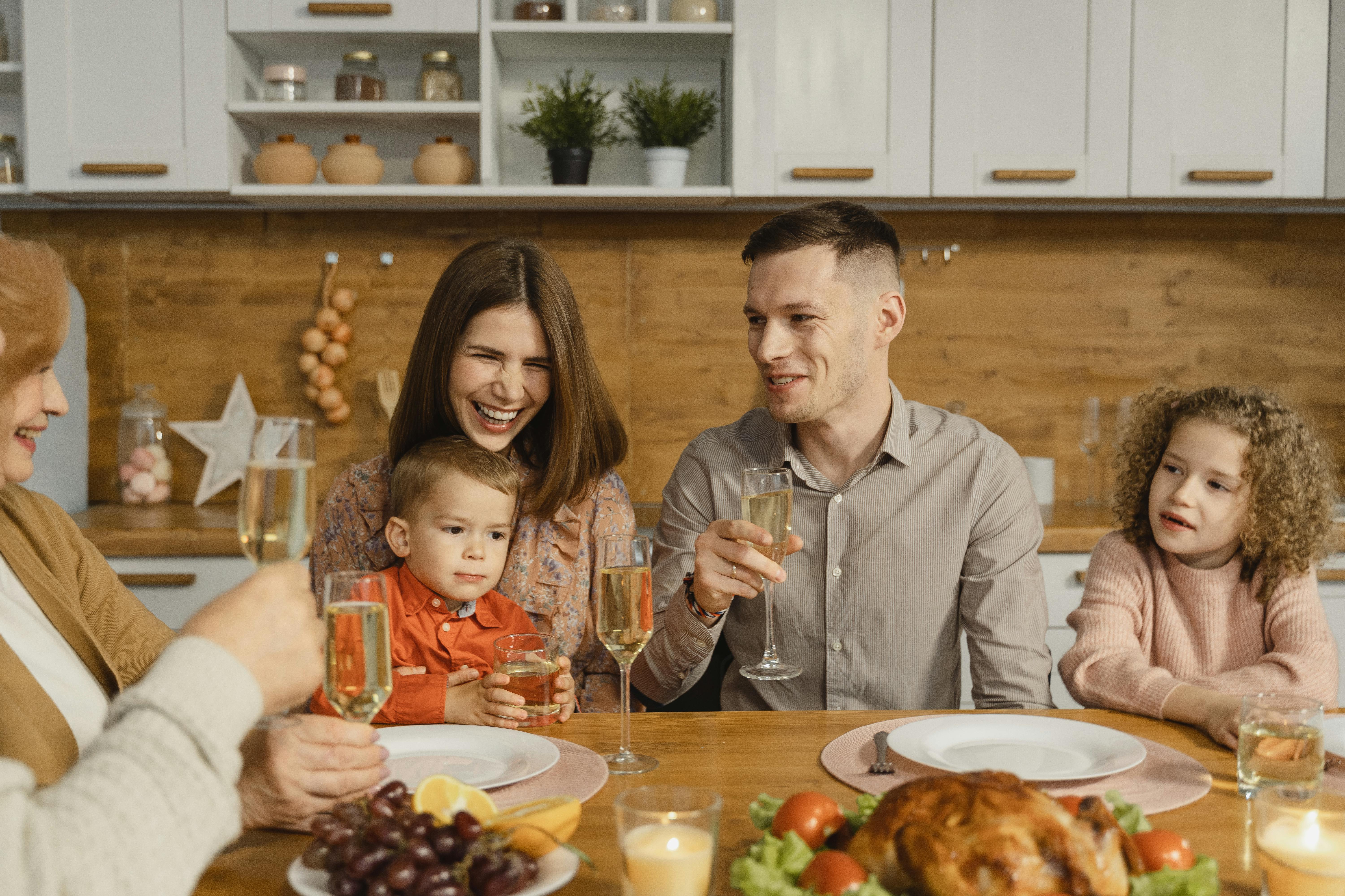 Family Eating Dinner Why Law Firms Offer Settlements