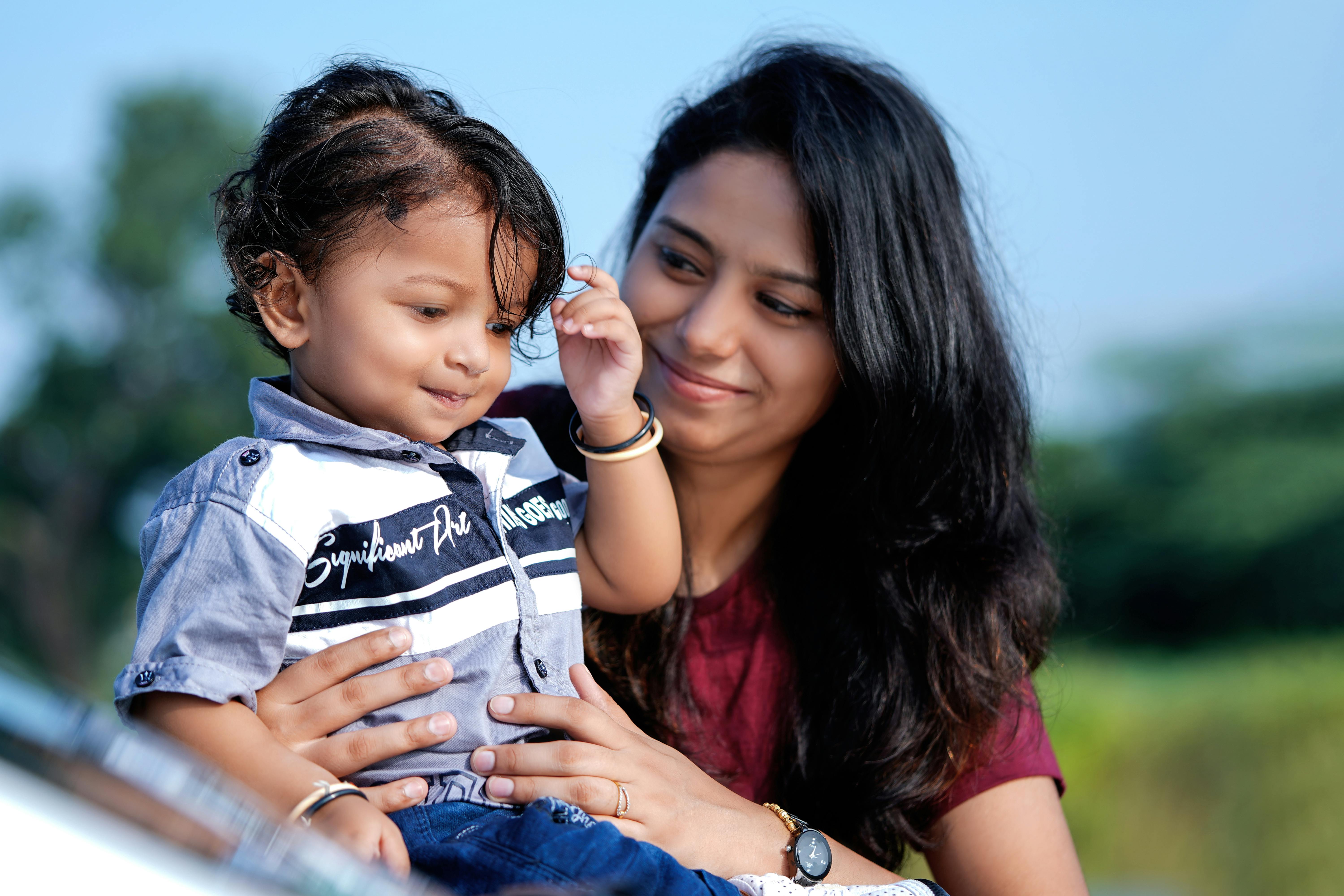 Mother Posing With Baby Can You Remove a Settled Account From Your Credit Report.jpg